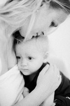 Mum embracing little daughter. Black and white shot