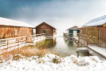 boat houses and docks in snow 
