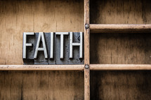 word faith on a bookshelf 