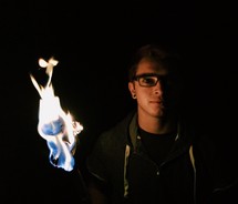 flames behind a man 