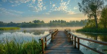 Wooden pier on a lake at sunrise in summer