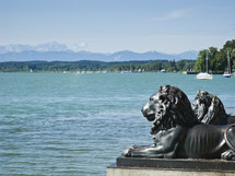 lion statues along a shore 