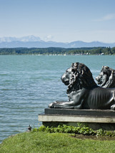 lion statues on a shore 