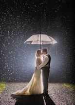 couple kissing in the rain 