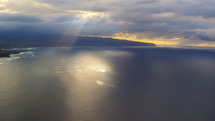 Sun light through clouds, over the ocean