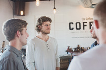 men gathered at a coffee shop 