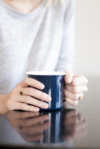 woman holding a coffee mug 