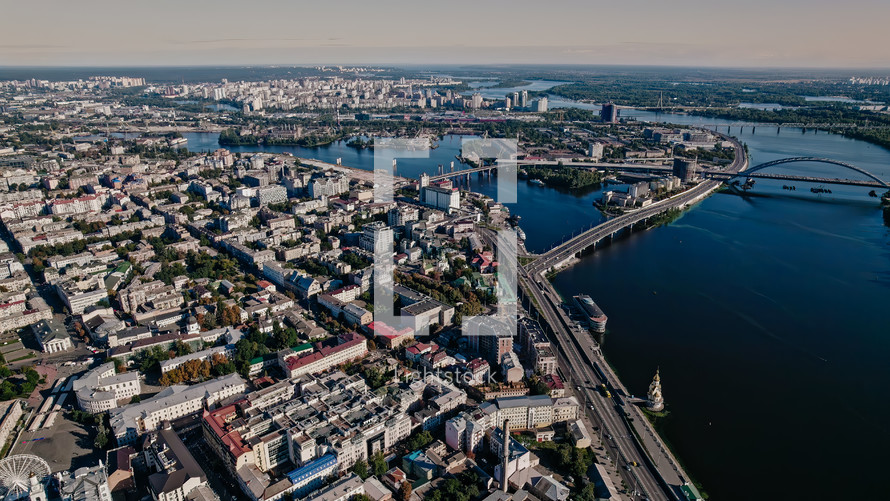 Kyiv, Ukraine - September, 2022: aerial drone view to Dnieper river near Podil. Flight over capital - one of greenest metropolis in Europe. Ecology, nature concept.