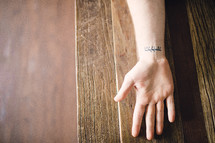 hebrew writing tattoo on a wrist 