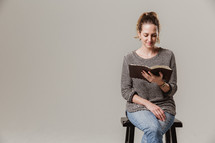 woman siting reading a Bible 
