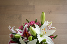 vase of pink and white lilies 