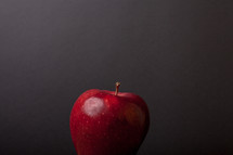 an apple against a blackboard 