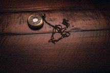 pocket watch on a table 