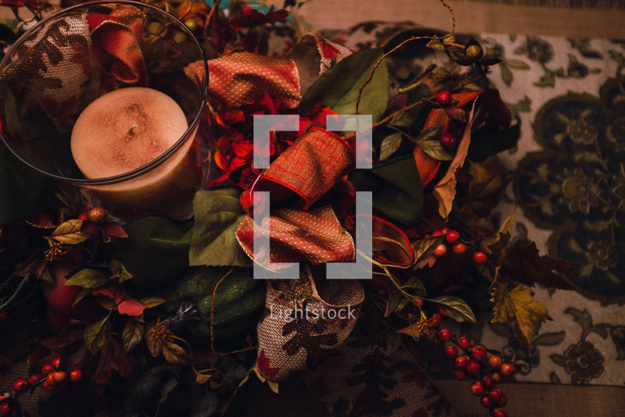holly and berries and Christmas candle 