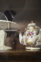 old teapot in cupboard