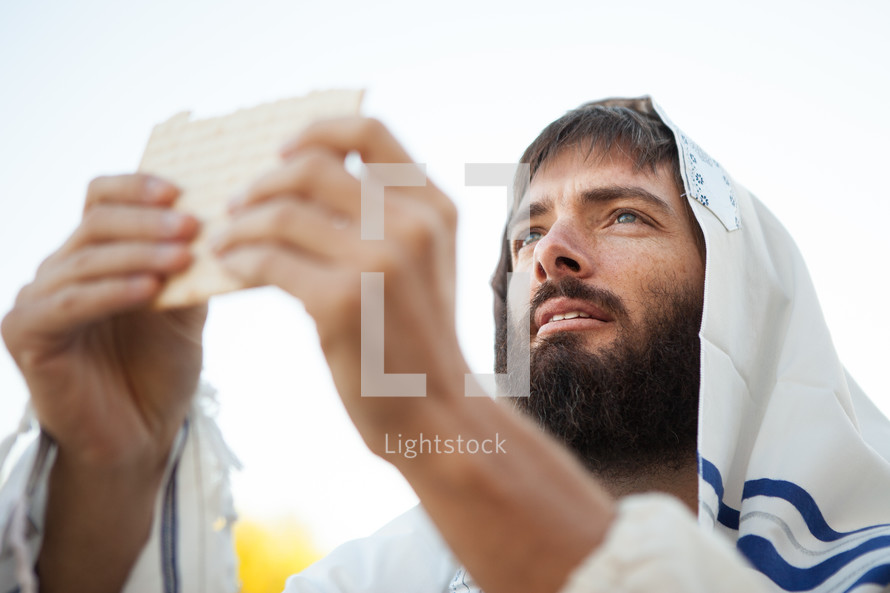 Jesus holding unleavened bread.