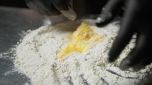 Hand Of Chef Making Egg And Flour Dough At Hotel Restaurant In Italy
