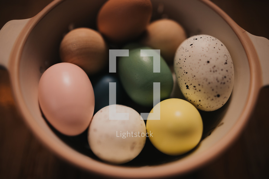 wooden Easter eggs in a bowl 