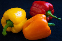 red, yellow, and orange bell peppers 