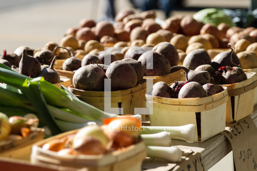 A table of vegetables at a Farmer's Market.