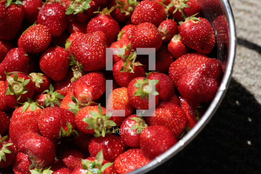 a bowl of fresh strawberries 
