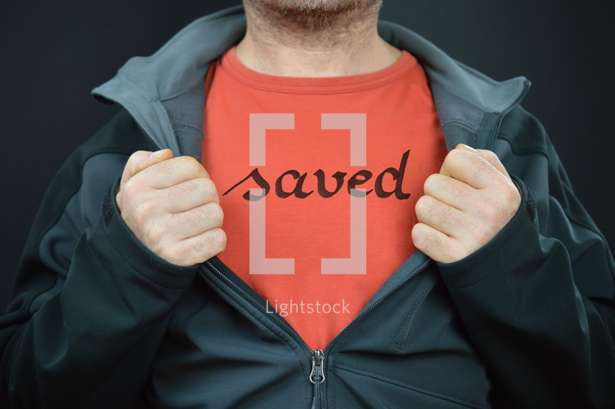 a man with the word saved on his t-shirt 