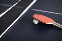 ping pong paddle on a table tennis table.