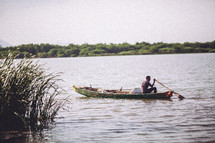 A man in a fishing boat. 