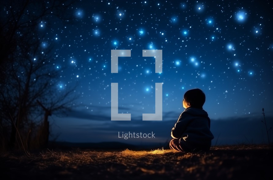 A child sitting alone watching a bright starry sky at night