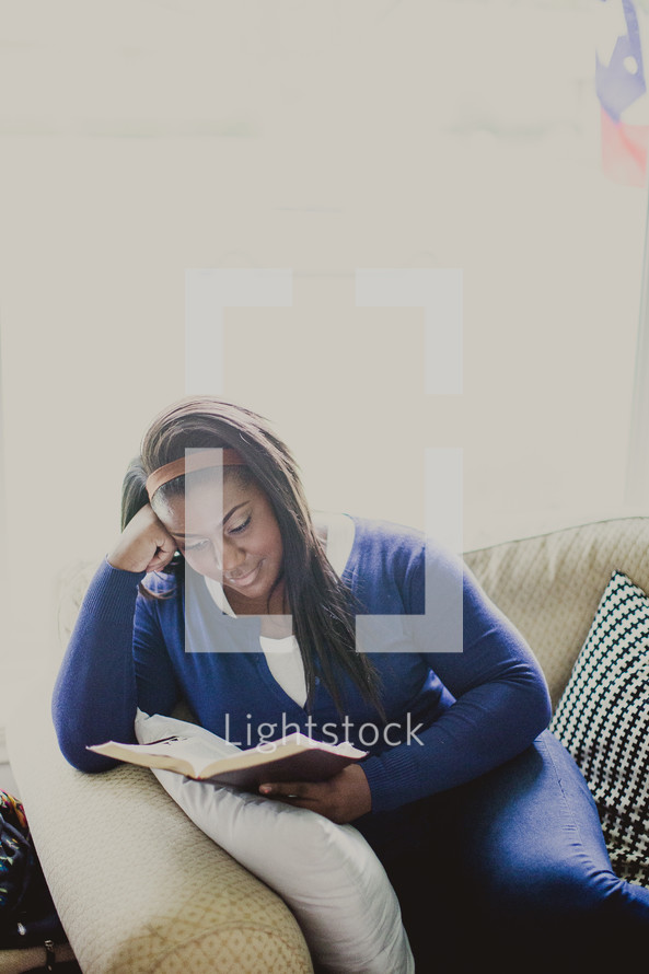 African-American woman reading a Bible