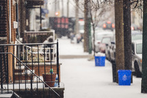 falling snow on a city sidwalk 