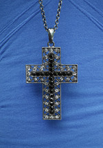 Cross necklace over blue shirt