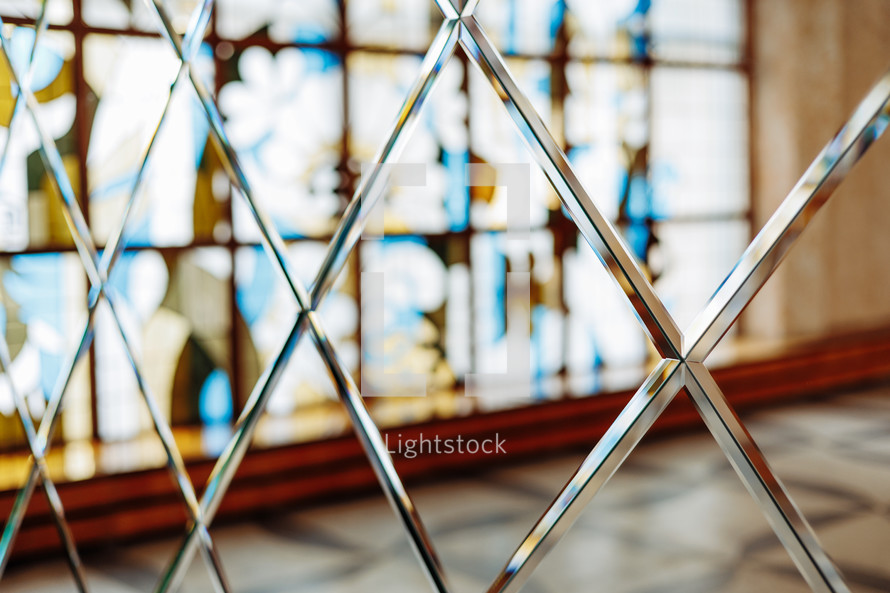 luxury mirror wall with crystals, decoration and reflection. Abstract glass background. Hotel or apartment interior. Polygonal surface. Close-up. Texture
