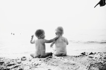 naked babies on a beach 