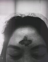 cross of ashes on a forehead 