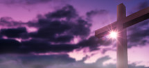 Christian worship and praise. Cross with sunset sky background. Easter.