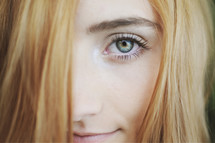 Blonde haired girl with green eyes.