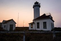 old lighthouse at sunset 
