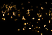 Bokeh from golden Christmas lights in the background. Perfect for your advent designs.