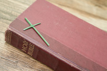 Flax cross on a Bible.