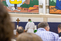pastor standing in front of the altar 