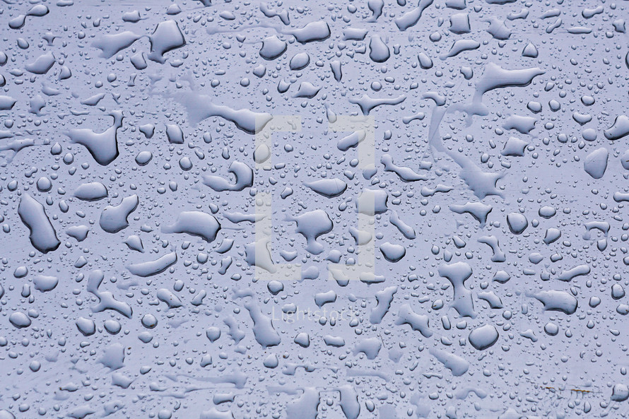 raindrops on the window in rainy days, abstract and blue background