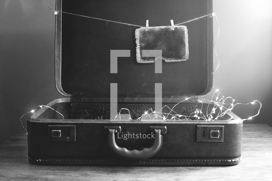 string of lights and photograph in a case 