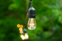 hanging lightbulbs outdoors 