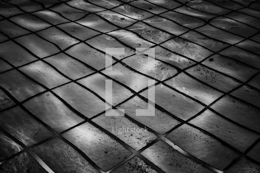 Minimal black texture background pool with tiles 