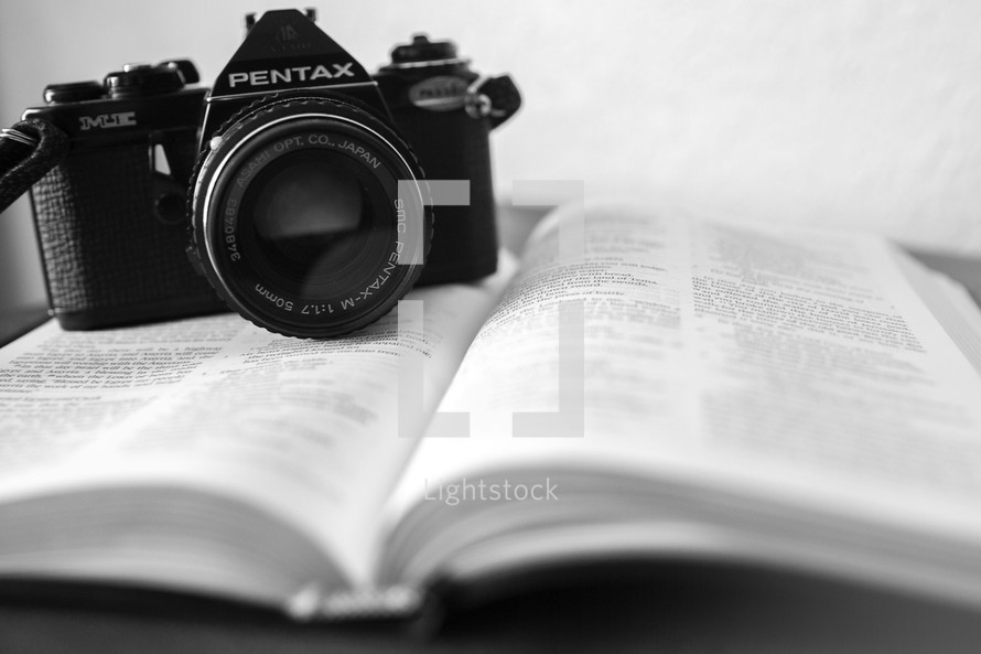 camera on an open Bible 