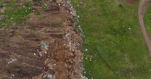 Aerial view of Environmental pollution of Garbage Dump In a Field. 