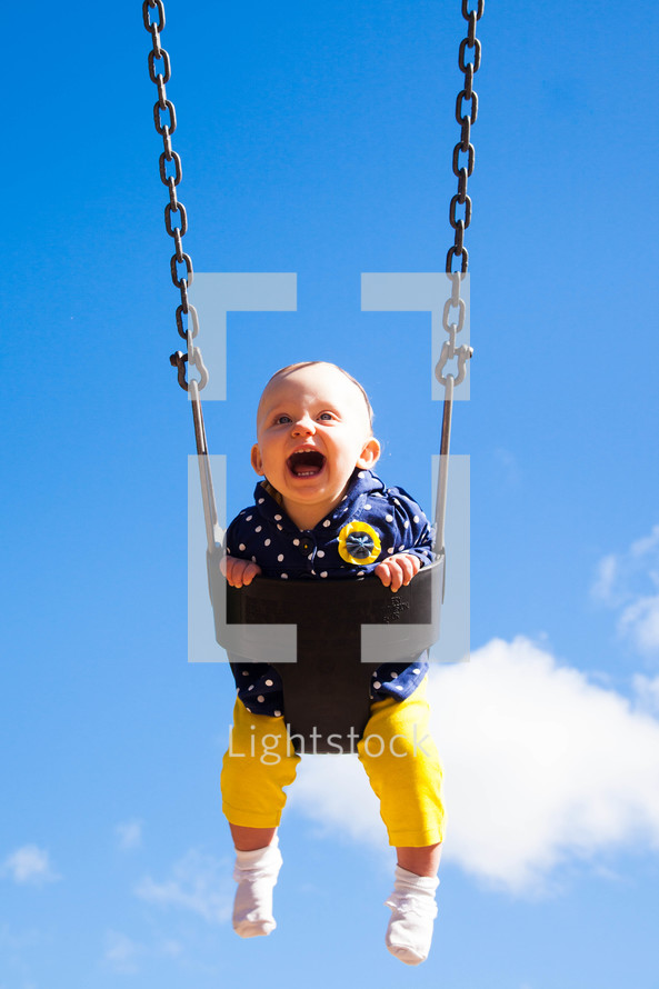 toddler on a swing