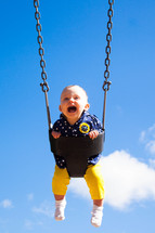 toddler on a swing