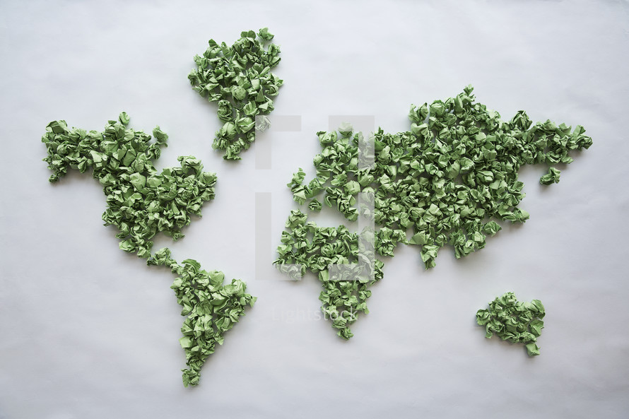 world map made with crumpled green pieces of paper. 